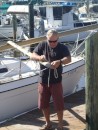 Jim adjusts a line at the end of the boom.