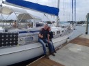 Juergen (left) and Kathrin rest against the rail of their newly purchased yacht, Amaroo. (Rivers Edge Marina, St. Augustine FL)