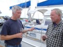 Juergen (left) and Jim drink a farewell toast just before Amaroo sets sail for points south. (Rivers Edge Marina, St. Augustine FL)