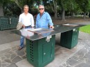 Peter (left) and Jim examine a public barbecue station along the riverside path.