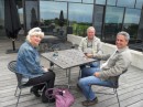 Despite high winds, we opt to sip our wines of choice out on the deck. (From left: Dianne, Jim & Peter)