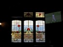Sunshine brightens stained-glass windows in the Exford Hotel Pub where we stop for a drink.