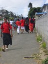 August is rugby season, and on this Friday many Tongans and other locals sport the red and white colors of Tonga in support of the Tongan national rugby team, which is to play in the opening game of the rugby World Cup.