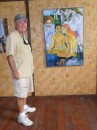 Jim by a copy of a Gauguin painting inside the House of Pleasure 