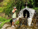 Jim drinking water from the spring by a shrine on Fatu Hiva
