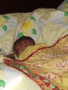 Baby Sterling sleeping on the boat under his new Grandma-made blankie.