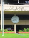 Close-up of the entrance of the Executive Office Building and its offricial American Samoan Government seal.