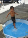 Three-year-old Mateo is delighted with the new pool Papa Hugel (Hasta Manana) is filling for him on the pier.
