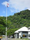 The American and American Samoa flags fly high downtown in front of the District Court building.