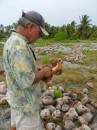 Jim scrapes out some fresh coconut at the coconut farm.