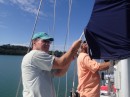 Thursday morning, March 6, get our despacho for the next port and get ready to leave Luperon. Here Charlie (left) and Jim prepare to raise the mainsail.
