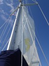 We raise the mainsail before leaving the harbor. (Radio Flyer mainsail with Beneteau seahorse symbol.)