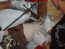 The tattooist checks his work. (For more tattoo photos, see sub-album TATTOO FESTIVAL under TUTUILA - AMERICAN SAMOA: September - December 2010.)