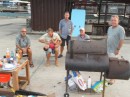 Nightly barbecues on the dock were the rule from late May to late June. Jim (far right) served as chef. Other regulars included (from left) Mac (Honu); Dan (Leeway) seen tickling 3-year-old Mateo (Hasta Manana); Hugo (Hasta Manana); and Mike (Honu). The barbecue unit was graciously lent by our architect friend and long-time island resident Joe from Greenville, Mississippi.
