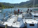 Rachel, Kez, and Asher gather on the adjacent catamaran to say goodbye to Hugo and Mateo as Hasta Manana prepares to leave Pago Pago Harbor in mid-June.