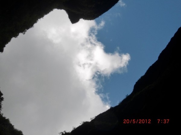 From the cool pool below you can see the sky through the clearing of the cliff face