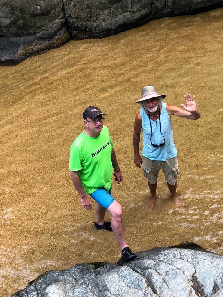 Eric and Kirk wading in the shallow-end of the natural pool at the Quimixto waterfalls.
