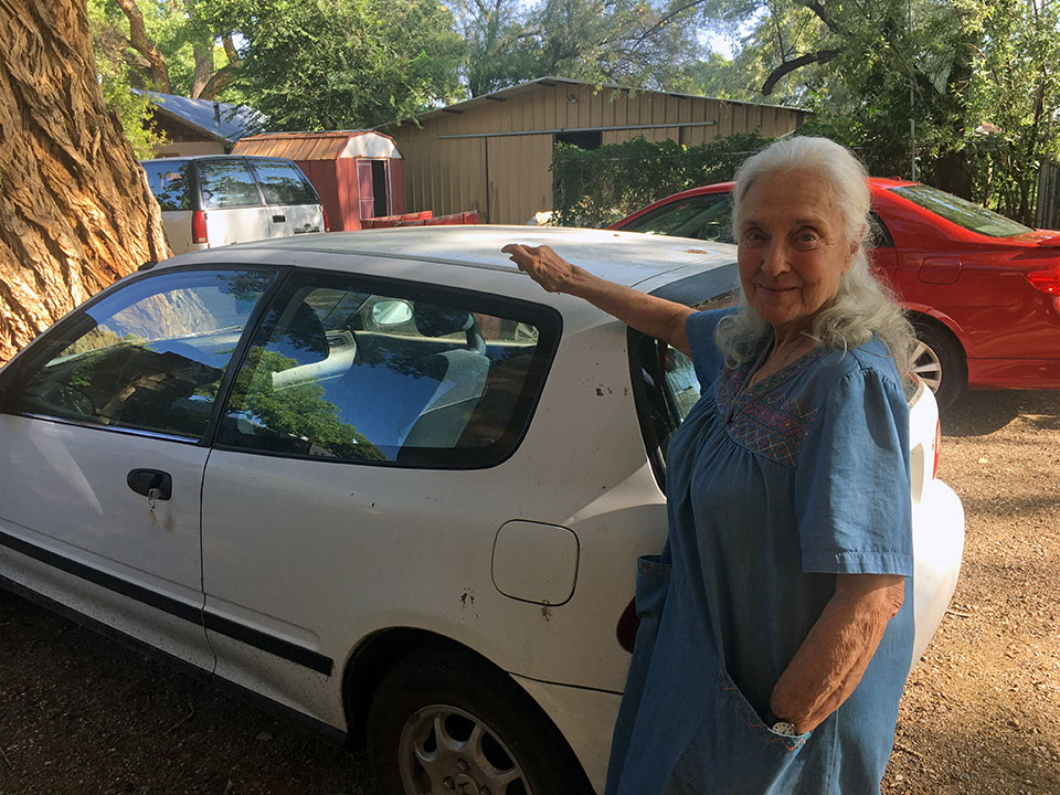 Willa saying goodbye to her trusty Honda before donating it to NPR for a new home. 