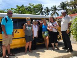 Bel and Gustavo arrived in his taxi-van to pick us up at the Platten Charter Base just as planned. It was so wonderful to see Bel again! We had missed her cheery smile, laugh, and demeanor and were all excited for her to  show us around more of her Caribbean island home. Rob, Val, Bel, Kelly, Heidi, Capitana Teresa, and Gustavo, (photo by Kirk.)