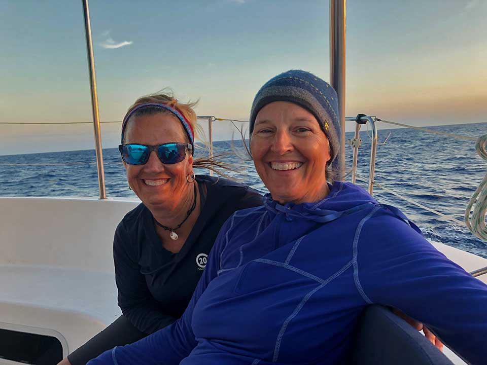 Val and Heidi bundled up for our night watch. Even in the tropics it gets chilly when the sun goes down and it’s blowing 20kts in your face! Heidi’s cozy hat from her brother Paul has constellations on it, including the Big Dipper and Orion, and we saw both that night.