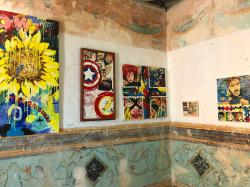 Heidi loves this photo juxtaposing modern Cuban pop-art against the 200+ year old painted walls in this Sugar Baron mansion-turned-gallery. This room was likely once an upstairs bedroom.
