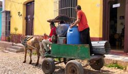Trinidad has cobblestoned streets with lots of horse carts. Even the public transportation is horse carts. These guys are delivering drinking water by horse cart... it’s a bit like stepping back in time.