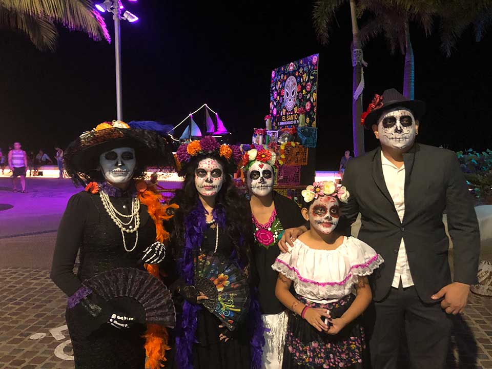 Dia de los Muertos is a bigger deal here than Halloween, although the commercialization of Halloween is taking over some of the stores. Many families dress up with their Catrina face paint for the night (Nov 1st celebrates children who