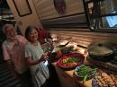 Sara and her brother Fred with the Thanksgiving spread including: smoked turkey, vegan mashed potatoes, stove-top-stuffing, grilled veggies (green beens, peppers, mushrooms, eggplant, sweet potatoes, and asparagus), a green salad, and tequila-lime-shrimp skewers!