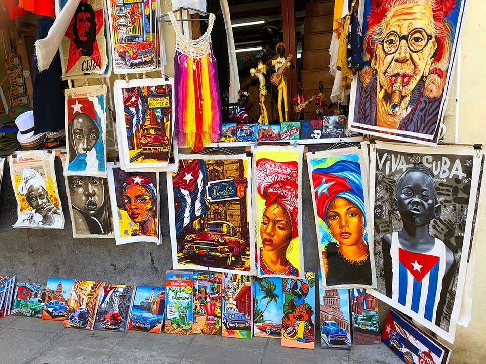 Street artists are everywhere selling colorful paintings depicting Ché, Cubanos, classic cars, and tropical scenes. 