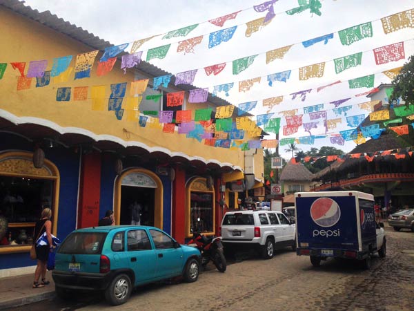 Downtown Sayulita with banners flying.