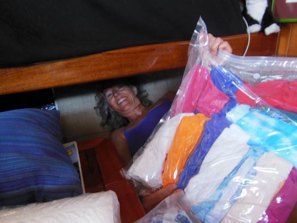 Half-way to La Cruz, it finally got hot enough to sail naked, or at least with minimal clothing. The only problem was, all of the warm-weather clothes were stashed away! So Heidi went spelunking under the salon-bunk to dig out some cooler clothing. 