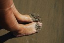 Sydney growing sand on her feet
