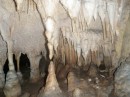 Columns are formed when a stalactite and stalagmite meet and fuse.  This one has about an inch to go to become a column. 