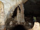 It was quite warm in the cave and very humid.  This picture of Donna taking off her outer shirt shows the size of the main passage.