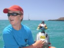 Foster is the captain towing two inflatable kyaks through the shallow waters of Bahia San Gabriel.