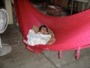 A baby takes a nap Mexican style at the cantina.
