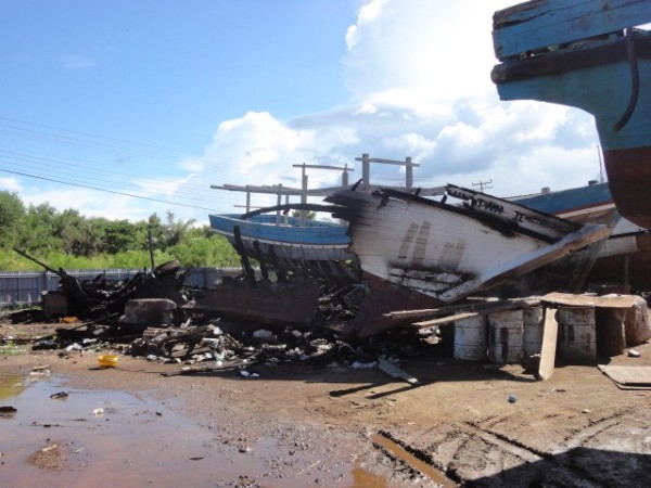 A burned out boat in the yard.  The yard had reposessed the boat when the owner hadn