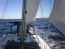Full sail facing aft.