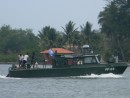 Navy patrol boat, looks like it could sink any minute