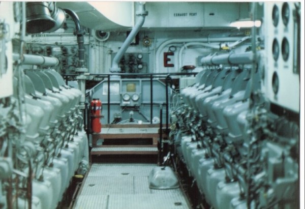 One of three engine rooms aboard the USS Frederick (LST-1184).  Those are two of six ALCO (American Locomotive Company) V-16 train engines which powered Frederick at up to 22 knots.  Note the red "E" on the bulkhead; awarded by the Surface Force Type Commander for engineering excellence.  It was aboard Frederick that I qualified as an Engineering Officer of the Watch.