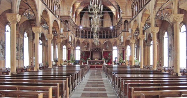 The interior of Sainte-Peter and Sainte-Paul Kathedraal is gorgeous; multiple layers of old paint have been removed, and the sanctuary has been restored to a warm natural wood finish.	