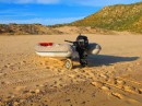 Our dinghy, now christened "Rudy" for his red nose.  The wheels are a great help to get it up the beach