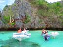 The gang take an expedition by dinghy to snorkle the Cathedral Cave