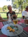 Vivienne of SY Largo Star showing Pete where thy are anchored close to Burano - the island famous for their lace making. In the foreground are the Burano Biscuits we had for dessert... one must dip the biscuit in the sweet wine which accompanies them - yummy!  