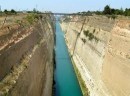 Also borrowed from Wikipedia images, here is a photo of the Corinth Canal in the daylight. This bit of engineering has had a very spotty history: Although it was first  completed in 1893 the first to propose such an undertaking was the tyrant Periander in the 7th century BC.  The Roman emperor Nero was the first to actually attempt to construct the canal in AD 67, personally breaking the ground with a pickaxe. His workforce, consisting of 6,000 Jewish prisoners of war, started digging trenches from both sides, while a third group at the ridge drilled deep shafts for probing the quality of the rock.  A memorial of the attempt in the form of a relief of Hercules was left by Nero