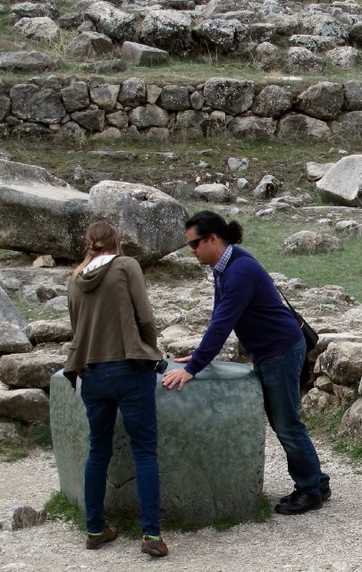 Here our knowledgeable & fun tour guide "Tas" shows one of our fellow tourists his "favorite rock" in Hattusa! "The green square stone in front of the Great Temple is considered a wedding gift of Egyptian pharaoh Ramesses II." Virtual Tourist