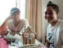 Mission Complete!: With her brother Andres looking on Amaya finishes the gingerbread house – complete with icicles!