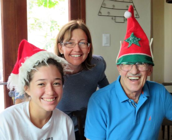 Getting into the Christmas spirit!: Peter is SO happy to be with Cindi and her family he actually enjoys dressing up for the photo!