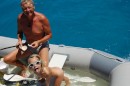 Hapai 0430001: Uwe and Kara take a shower in the dinghy