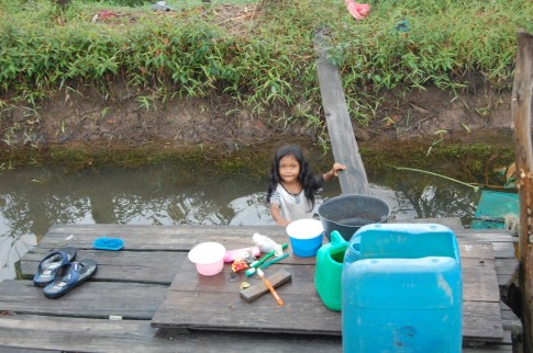 A most charming little girl in the most uncharming village along the Kumai river, Borneo